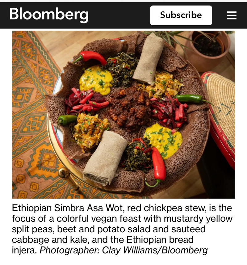 Bloomberg article about Ethiopian food featuring a dish with text overlay.